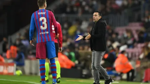 Xavi Hernández y Gerard Piqué en un encuentro del Barcelona.