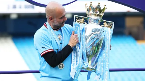 MANCHESTER, ENGLAND - MAY 21: Pep Guardiola, Manager of Manchester City, celebrates with the Premier League trophy following after the Premier League match between Manchester City and Chelsea FC at Etihad Stadium on May 21, 2023 in Manchester, England. (Photo by Catherine Ivill/Getty Images)