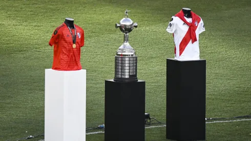 BUENOS AIRES, ARGENTINA – DECEMBER 09: Copa Libertadores trophy and jerseys are displayed on the pitch before the "Copa Eterna" celebrations at Estadio Monumental Antonio Vespucio Liberti on December 9, 2021 in Buenos Aires, Argentina. On the third anniversary of the Copa Libertadores final won against Boca Juniors in Madrid, fans of River Plate gather at their stadium to celebrate. (Photo by Marcelo Endelli/Getty Images)