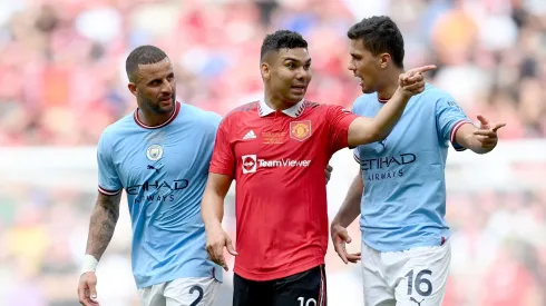 LONDON, ENGLAND - JUNE 03: Casemiro of Manchester United gestures next to Rodri of Manchester City during the Emirates FA Cup Final between Manchester City and Manchester United at Wembley Stadium on June 03, 2023 in London, England. (Photo by Shaun Botterill/Getty Images)