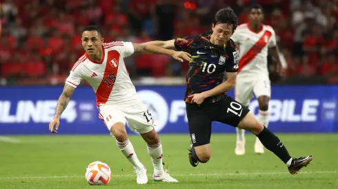 BUSAN, SOUTH KOREA - JUNE 16: Lee Jae-Sung of South Korea competes for the ball with Yoshimar Yotun of Peru during the international friendly match between South Korea and Peru at Busan Asiad Stadium on June 16, 2023 in Busan, South Korea. (Photo by Chung Sung-Jun/Getty Images)