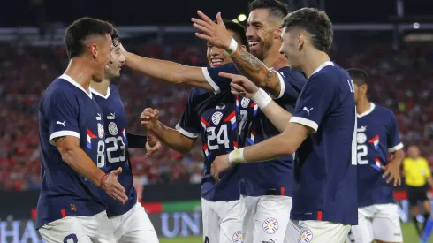 SANTIAGO, CHILE - MARCH 27: Gabriel Avalos (R) of Paraguay celebrates with teammates after scoring the second goal of his team during an international friendly match against Paraguay at Estadio Monumental David Arellano on March 27, 2023 in Santiago, Chile. (Photo by Marcelo Hernandez/Getty Images)