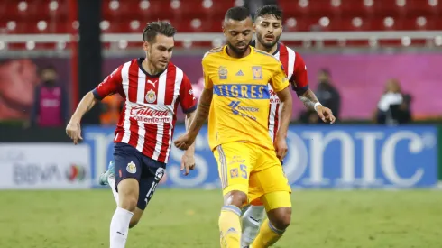 ZAPOPAN, MEXICO – SEPTEMBER 13: Jesús Angulo of Chivas fights for the ball with Rafael De Souza of Tigres during the 9th round match between Chivas and Tigres UANL as part of the Torneo Apertura 2022 Liga MX at Akron Stadium on September 13, 2022 in Zapopan, Mexico. (Photo by Refugio Ruiz/Getty Images)