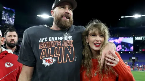 Travis Kelce #87 of the Kansas City Chiefs celebrates with Taylor Swift after a 17-10 victory against the Baltimore Ravens.