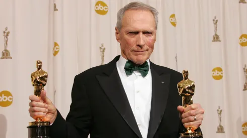 Director Clint Eastwood poses with his Oscar award for Best Director in "Million Dollar Baby" backstage during the 77th Annual Academy Awards on February 27, 2005 at the Kodak Theater in Hollywood, California. (Photo by Carlo Allegri/Getty Images)