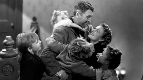 James Stewart, Donna Reed, Carol Coombs, Karolyn Grimes, Jimmy Hawkins and Larry Simms in It’s a Wonderful Life.