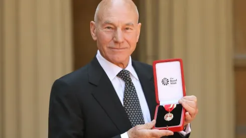 Actor Sir Patrick Stewart poses with his award after he was Knighted by Britain's Queen Elizabeth II at Buckingham Palace.