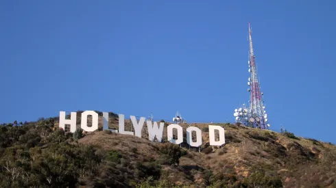 HOLLYWOOD - MARCH 30: A fire department helicopter flies over the Hollywood sign, after filling up on water, to extinguish the brush fire that broke out in the Hollywood Hills on March 30, 2007 in Hollywood, California. The fire which started near a corporate housing complex is burned close to the famous Hollywood sign. (Photo by Trixie Textor/Getty Images)