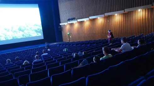 BERLIN, GERMANY - JULY 02: People arrive to watch a late night film at Kino International on the first day that cinemas reopened in Berlin during the novel coronavirus pandemic on July 02, 2020 in Berlin, Germany. Germany is continuing to lift lockdown restrictions nationwide while at the same time remaining wary of possible further outbreaks. (Photo by Sean Gallup/Getty Images)