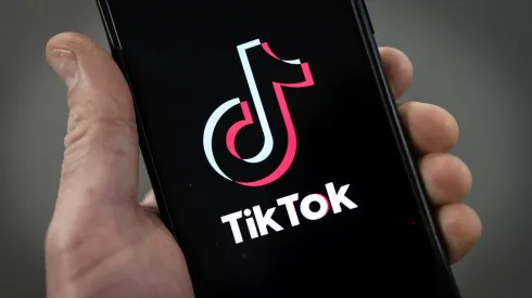 LONDON, ENGLAND - FEBRUARY 28: In this photo illustration, a TikTok logo is displayed on an iPhone on February 28, 2023 in London, England. This week, the US government and European Union's parliament have announced bans on installing the popular social media app on staff devices. (Photo by Dan Kitwood/Getty Images)