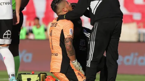 Brayan Cortés en el piso del estadio Monumental