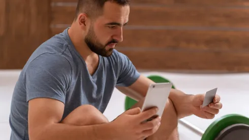 RECORD DATE NOT STATED Handsome bearded guy holding debit or credit card in hands using smartphone buying online. Modern digital life. Digital app on smartphone., model released, , 43785364.jpg, interface, internet, male, man, online, shopping, sport, technology, website, screen, application, apps, banking, betting, card, caucasian, computing, credit, debit, digitally, e-commerce, electronic, generated, image, money, purchase, gamble, result, adult, score, spending, young, course customer, mock mockup, one online, people person, phone playing, purchase read, business, businessman, holding, mobile, phone