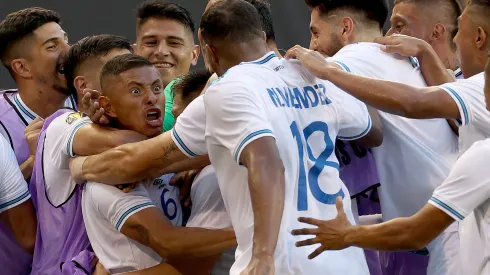 HARRISON, NEW JERSEY - JULY 04: Carlos Mejía #6 of Guatemala is surrounded by teammates after he scored the game winning goal during the second half of the Group D match against Guadeloupe the Concacaf Gold Cup at Red Bull Arena on July 04, 2023 in Harrison, New Jersey. Guatemala defeated Guadeloupe 3-2. (Photo by Elsa/Getty Images)