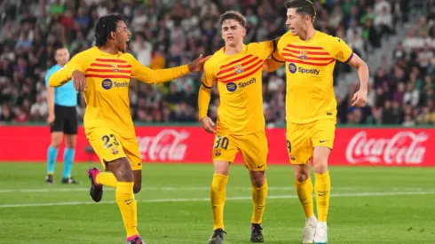 ELCHE, SPAIN – APRIL 01: Robert Lewandowski (R)of FC Barcelona celebrates with teammates Jules Kounde and Gavi after scoring the team's third goal during the LaLiga Santander match between Elche CF and FC Barcelona at Estadio Manuel Martinez Valero on April 01, 2023 in Elche, Spain. (Photo by Aitor Alcalde/Getty Images)
