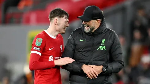 LIVERPOOL, ENGLAND – DECEMBER 20: Juergen Klopp, Manager of Liverpool, celebrates with Conor Bradley following the team's victory during the Carabao Cup Quarter Final match between Liverpool and West Ham United at Anfield on December 20, 2023 in Liverpool, England. (Photo by Michael Regan/Getty Images)
