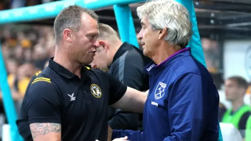 Pellegrini y el DT del County.