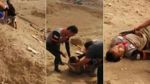 El árbitro acostado en el desierto mientras es asistido por gente local