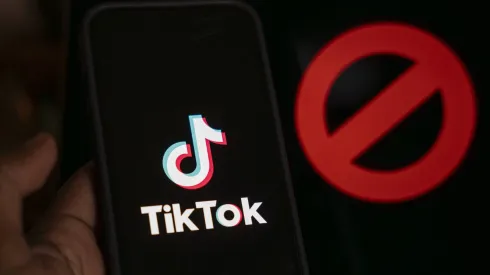 April 25, 2024: In this photo illustration, logo of Tiktok is displayed on mobile phone screen next to ban sign, in Guwahati, India 25 April 2024. US President Joe Biden signs law to ban Chinese-owned TikTok unless sold to US company. – ZUMAt232 20240425_zip_t232_002 Copyright: xDavidxTalukdarx