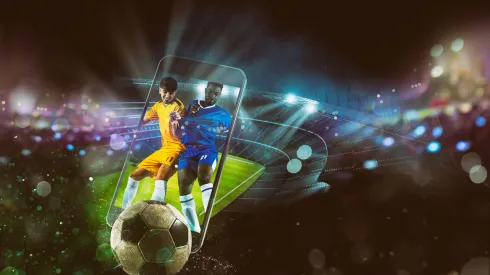 2PPGWJ3 Watch a live sports event on your mobile device. Betting on football matches