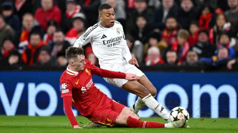 LIVERPOOL, ENGLAND – NOVEMBER 27: Kylian Mbappe of Real Madrid is challenged by Conor Bradley of Liverpool during the UEFA Champions League 2024/25 League Phase MD5 match between Liverpool FC and Real Madrid C.F. at Anfield on November 27, 2024 in Liverpool, England. (Photo by Justin Setterfield/Getty Images)