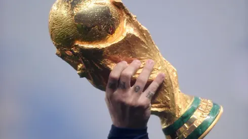 MOSCOW, RUSSIA - JULY 15: Antoine Griezmann of France holds the World Cup trophy aloft during the victory celebrations after the 2018 FIFA World Cup Russia Final between France and Croatia at Luzhniki Stadium on July 15, 2018 in Moscow, Russia. (Photo by Laurence Griffiths/Getty Images)