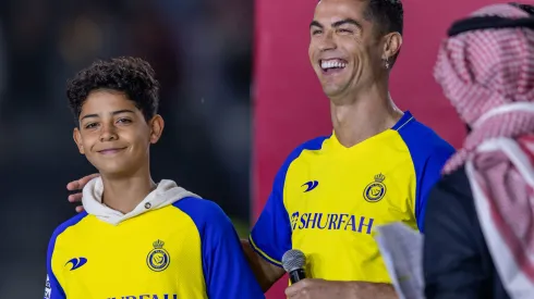 RIYADH, SAUDI ARABIA - JANUARY 03: Cristiano Ronaldo and his son Cristiano Ronaldo Jr greet the crowd during the official unveiling of Cristiano Ronaldo as an Al Nassr player at Mrsool Park Stadium on January 3, 2023 in Riyadh, Saudi Arabia. (Photo by Yasser Bakhsh/Getty Images)