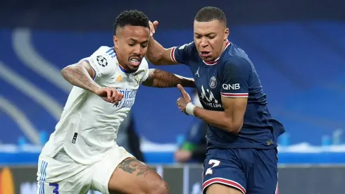 Kylian Mbappe of Paris Saint-Germain competes for the ball with Eder Militao of Real Madrid. (Photo by Angel Martinez/Getty Images)