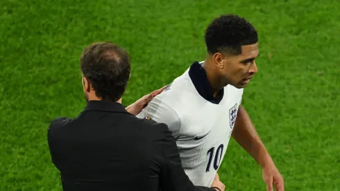 GELSENKIRCHEN, GERMANY - JUNE 16: Jude Bellingham of England embraces Gareth Southgate, Head Coach of England, after being substituted during the UEFA EURO 2024 group stage match between Serbia and England at Arena AufSchalke on June 16, 2024 in Gelsenkirchen, Germany. (Photo by Matthias Hangst/Getty Images)
