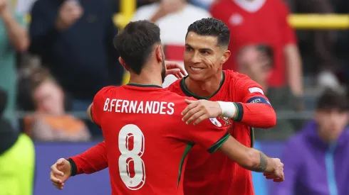 DORTMUND, GERMANY – JUNE 22: Bruno Fernandes of Portugal celebrates scoring his team's third goal with teammate Cristiano Ronaldo during the UEFA EURO 2024 group stage match between Turkiye and Portugal at Football Stadium Dortmund on June 22, 2024 in Dortmund, Germany. (Photo by Lars Baron/Getty Images)
