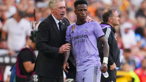 VALENCIA, SPAIN - MAY 21: Carlo Ancelotti, Head Coach of Real Madrid, interacts with Vinicius Junior of Real Madrid during the LaLiga Santander match between Valencia CF and Real Madrid CF at Estadio Mestalla on May 21, 2023 in Valencia, Spain. (Photo by Aitor Alcalde/Getty Images)