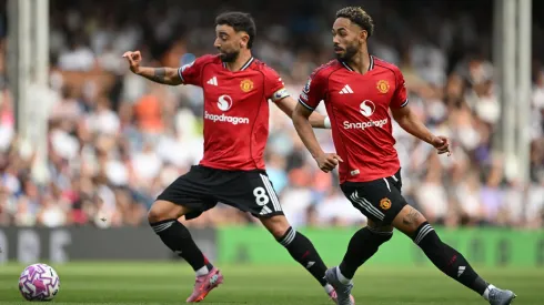 Bruno Fernandes e Matheus Cunha em jogo do United na Premier League (Foto: Mike Hewitt/Getty Images)