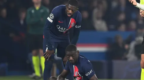 PARIS, FRANCE – OCTOBER 25: Fikayo Tomori of AC Milan reacts after receiving a yellow card from Referee Slavko Vincic for a foul on Randal Kolo Muani of Paris Saint-Germain during the UEFA Champions League match between Paris Saint-Germain and AC Milan at Parc des Princes on October 25, 2023 in Paris, France. (Photo by Mike Hewitt/Getty Images)