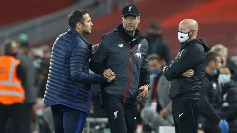 LIVERPOOL, ENGLAND – JULY 22: Frank Lampard, Manager of Chelsea and Jurgen Klopp, Manager of Liverpool embrace following during the Premier League match between Liverpool FC and Chelsea FC at Anfield on July 22, 2020 in Liverpool, England. Football Stadiums around Europe remain empty due to the Coronavirus Pandemic as Government social distancing laws prohibit fans inside venues resulting in all fixtures being played behind closed doors. (Photo by Phil Noble/Pool via Getty Images)