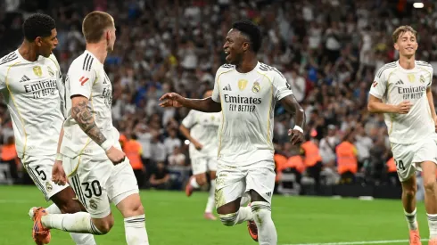 MADRID, SPAIN – OCTOBER 04: Vinicius Junior of Real Madrid celebrates with team mates Jude Bellingham and Franco Mastantuono after scoring his team's second goal during the LaLiga EA Sports match between Real Madrid CF and Villarreal CF at Estadio Santiago Bernabeu on October 04, 2025 in Madrid, Spain. (Photo by Denis Doyle/Getty Images)