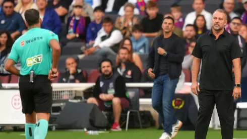 BARCELONA, SPAIN – OCTOBER 18: Referee, Jesus Gil Manzano shows a red card to Hansi Flick, Head Coach of FC Barcelona, during the LaLiga EA Sports match between FC Barcelona and Girona FC at Spotify Camp Nou on October 18, 2025 in Barcelona, Spain. (Photo by Alex Caparros/Getty Images)