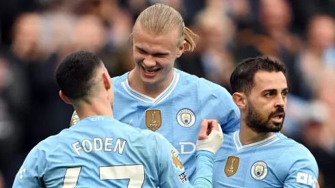 Erling Haaland do Manchester City com Phil Foden e Bernardo Silva (Foto: Michael Regan/Getty Images)