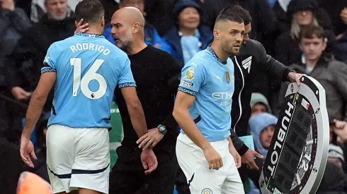 Rodri, jogador do Manchester City, e Pep Guardiola, treinador dos citizens, Imagens: Imago