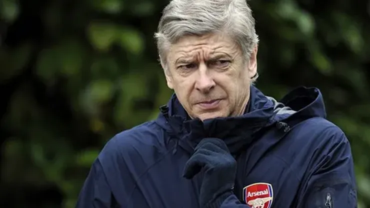 Arsenal's French manager Arsene Wenger gestures before a team training session at the club's Colney training ground in London on February 15, 2011 on the eve of the Champions League round of 16, 1st leg football match against Barcelona. AFP PHOTO/GLYN KIRK (Photo credit should read GLYN KIRK/AFP/Getty Images)