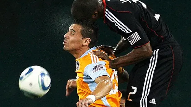 Julius James #2 of D.C. United climbs on the back of Geoff Cameron #20 of the Houston Dynamo during an MLS match at RFK Stadium in Washington D.C. on September 25 2010. Houston won 3-1.
