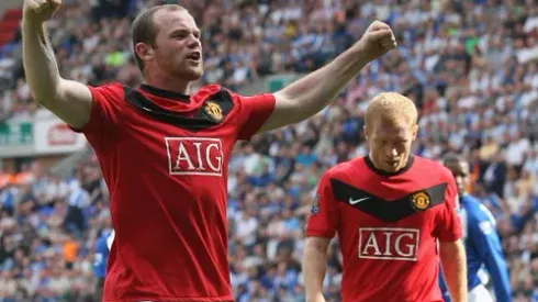 WIGAN, ENGLAND - AUGUST 22: Wayne Rooney of Manchester United celebrates scoring their first goal during the FA Barclays Premier League match between Wigan Athletic and Manchester United at DW Stadium on August 22 2009 in Wigan, England. (Photo by John Peters/Manchester United via Getty Images)