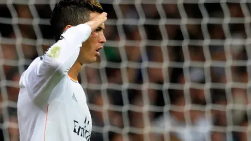 Real Madrid's Portuguese forward Cristiano Ronaldo gestures as he celebrates after scoring a penalty kick during the Spanish league football match Real Madrid CF vs Sevilla FC at the Santiago Bernabeu stadium in Madrid on October 30, 2013. AFP PHOTO / GERARD JULIEN (Photo credit should read GERARD JULIEN/AFP/Getty Images)