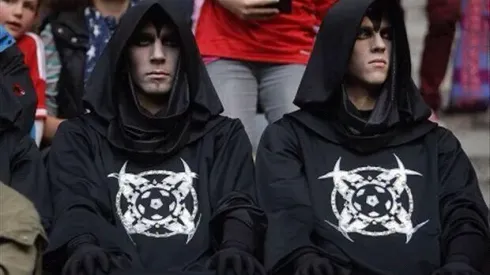 What’s the deal with the black hooded monks in robes at soccer games?