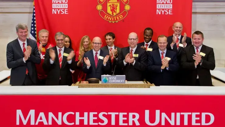 NEW YORK, NY – AUGUST 10: Manchester United Executives ring the Opening Bell at the New York Stock Exchange on August 10, 2012 in New York City. Manchester United Lists Initial Public Offering on the New York Stock Exchange. (Photo Ben Hider/NYSE Euronext)
