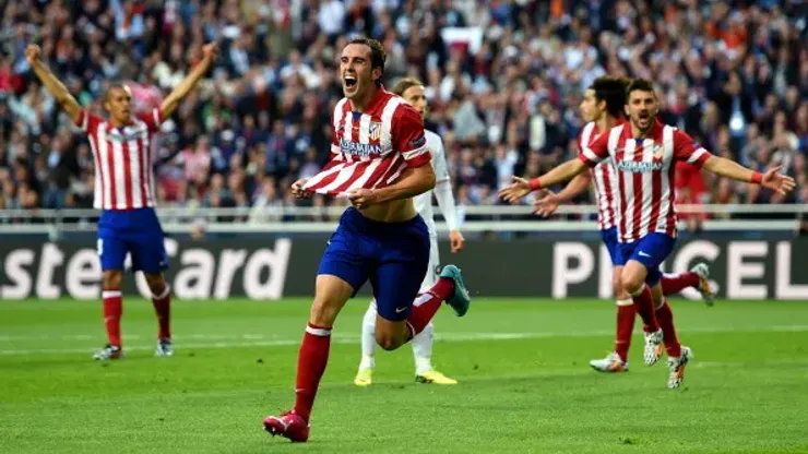 LISBON, PORTUGAL – MAY 24: Diego Godin of Club Atletico de Madrid celebrates scoring the opening goal during the UEFA Champions League Final between Real Madrid and Atletico de Madrid at Estadio da Luz on May 24, 2014 in Lisbon, Portugal. (Photo by Shaun Botterill/Getty Images)