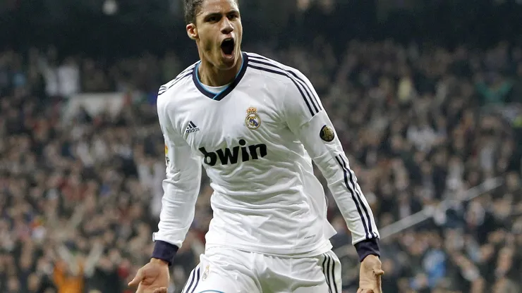MADRID, SPAIN – JANUARY 30: Raphael Varane of Real Madrid celebrates after score during the Copa del Rey Semi-Final first leg match between Real Madrid CF and FC Barcelona at Estadio Santiago Bernabeu on January 30, 2013 in Madrid, Spain. (Photo by Angel Martinez/Real Madrid via Getty Images)
