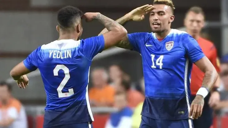 US Danny Williams (R) celebrates with US DeAndre Yedlin (L) after scoring a goal during the friendly football match between the Netherlands and USA on June 5, 2015 at the Arena Stadium in Amsterdam. AFP PHOTO / JOHN THYSJOHN THYS/AFP/Getty Images
