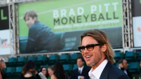 U.S. actor Brad Pitt, who stars as Oakland Athletics' general manager Billy Beane, arrives for the world premiere of the film "Moneyball" in Oakland, California September 19, 2011. REUTERS/Robert Galbraith (UNITED STATES - Tags: ENTERTAINMENT SPORT BASEBALL)