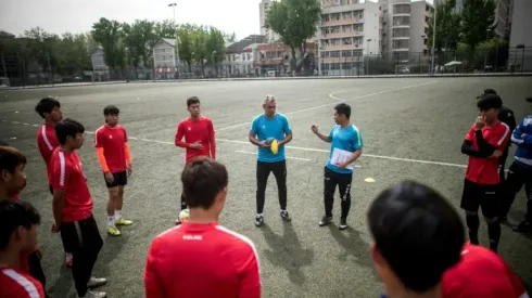 Pork, sweets off menu for 'fat' Chinese footballers as Spanish take charge