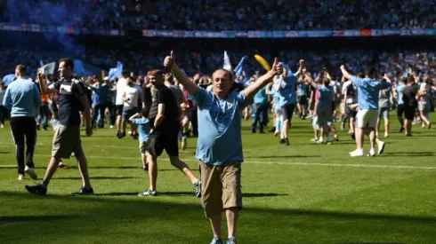 City lift Premier League trophy as Huddersfield celebrate precious point