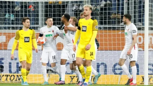 Dortmund held at Augbsurg to leave Bayern eight points clear